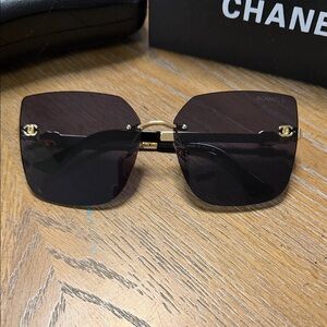 CHANEL Rimless Square Sunglasses in Black with Gold Details